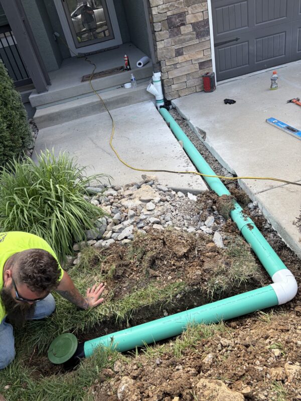 downspout pipe being buried